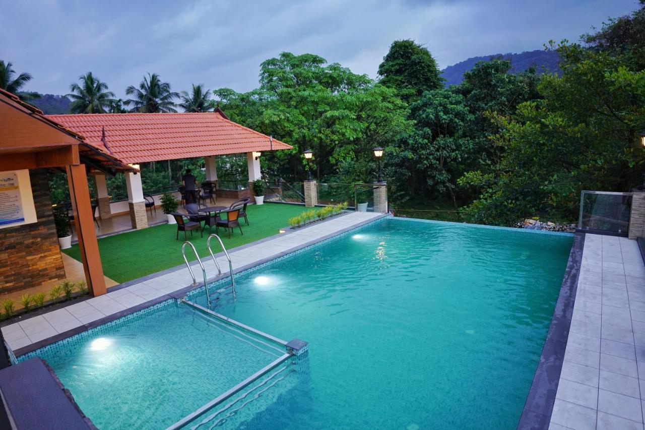 Rainland होटल Athirappilly